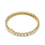 Yellow gold bracelet with diamond accents on a white background