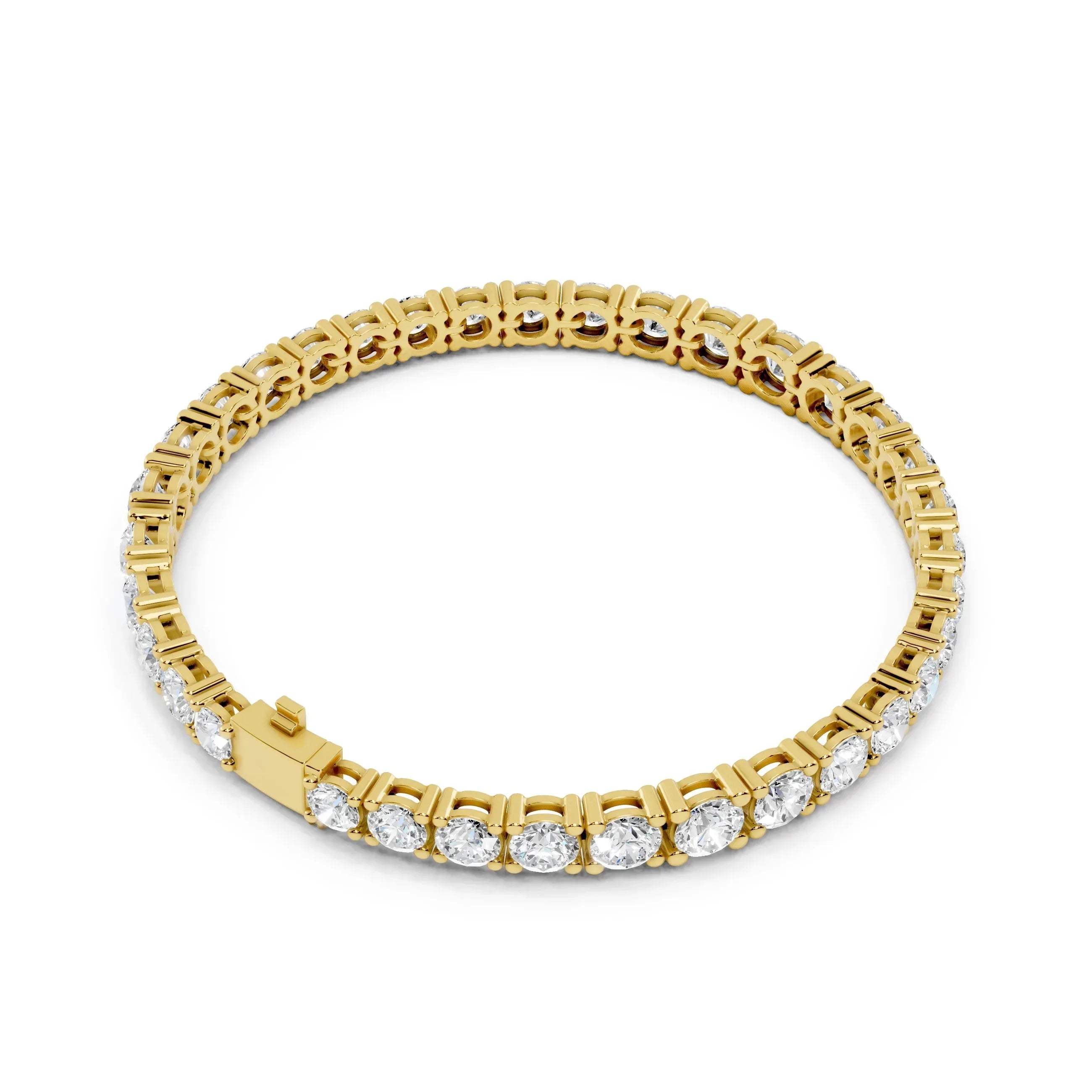 Yellow gold bracelet with diamond accents on a white background
