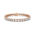 Rose gold bracelet with real diamond accents on a white background