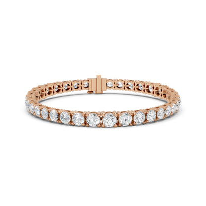 Rose gold bracelet with real diamond accents on a white background