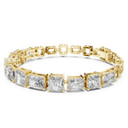 Yellow gold bracelet with rectangular and square-cut real diamonds on a white background
