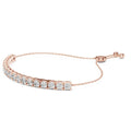 Rose gold bracelet with real diamonds accents on a white background