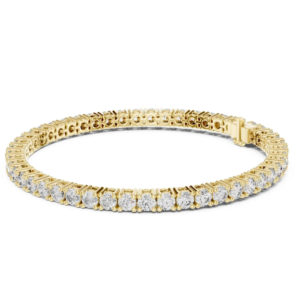 Yellow gold bracelet with real diamond accents on a white background.