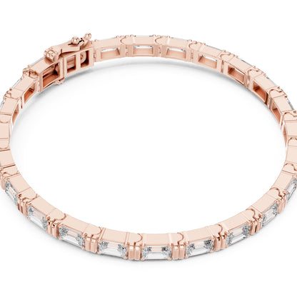 Rose gold bracelet with real diamonds on a white background