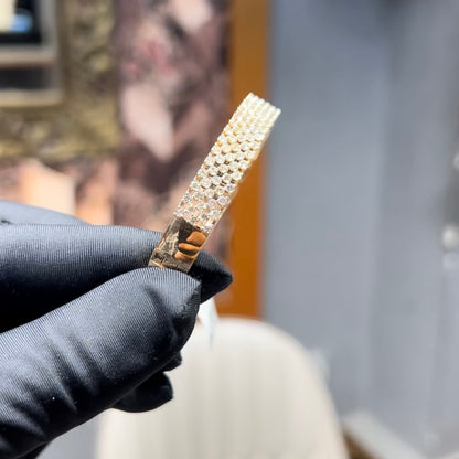 Elegant pavé set gold diamond bracelet with multiple rows of sparkling round-cut diamonds.