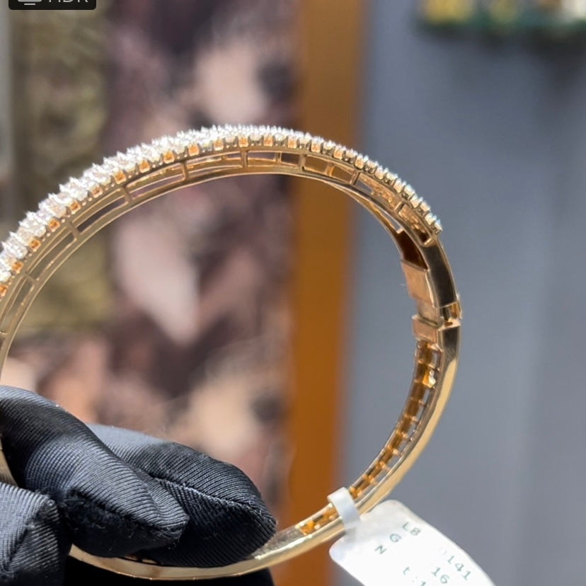 Elegant pavé set gold diamond bracelet with multiple rows of sparkling round-cut diamonds.