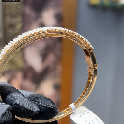 Elegant pavé set gold diamond bracelet with multiple rows of sparkling round-cut diamonds.