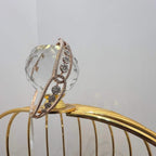 Gold diamond bracelet with round brilliant cut diamonds in chain-link bangle design displayed on luxury background.
