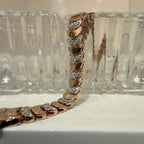 Elegant gold diamond bracelet crafted with unique crescent links and sparkling pavé-set diamonds.