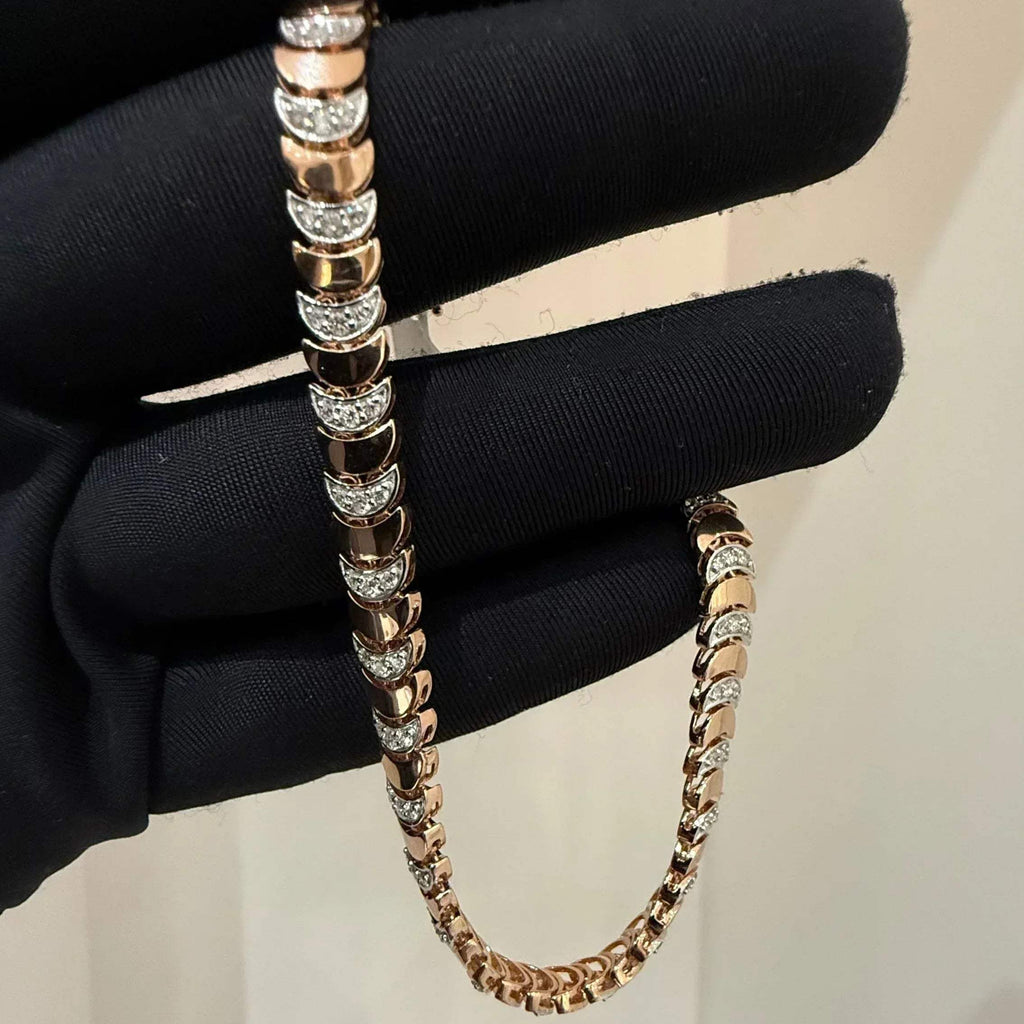 Elegant gold diamond bracelet crafted with unique crescent links and sparkling pavé-set diamonds.