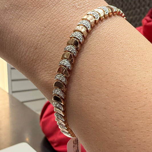 Elegant gold diamond bracelet crafted with unique crescent links and sparkling pavé-set diamonds.