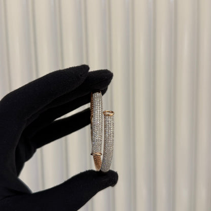 Luxury rose gold diamond bracelet featuring multiple rows of sparkling diamonds in a stylish cuff shape.