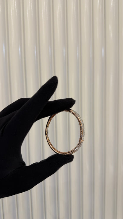 Luxury gold diamond bracelet featuring multiple rows of sparkling diamonds in a stylish cuff shape.