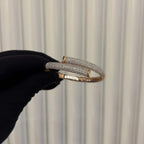 Luxury gold diamond bracelet featuring multiple rows of sparkling diamonds in a stylish cuff shape.