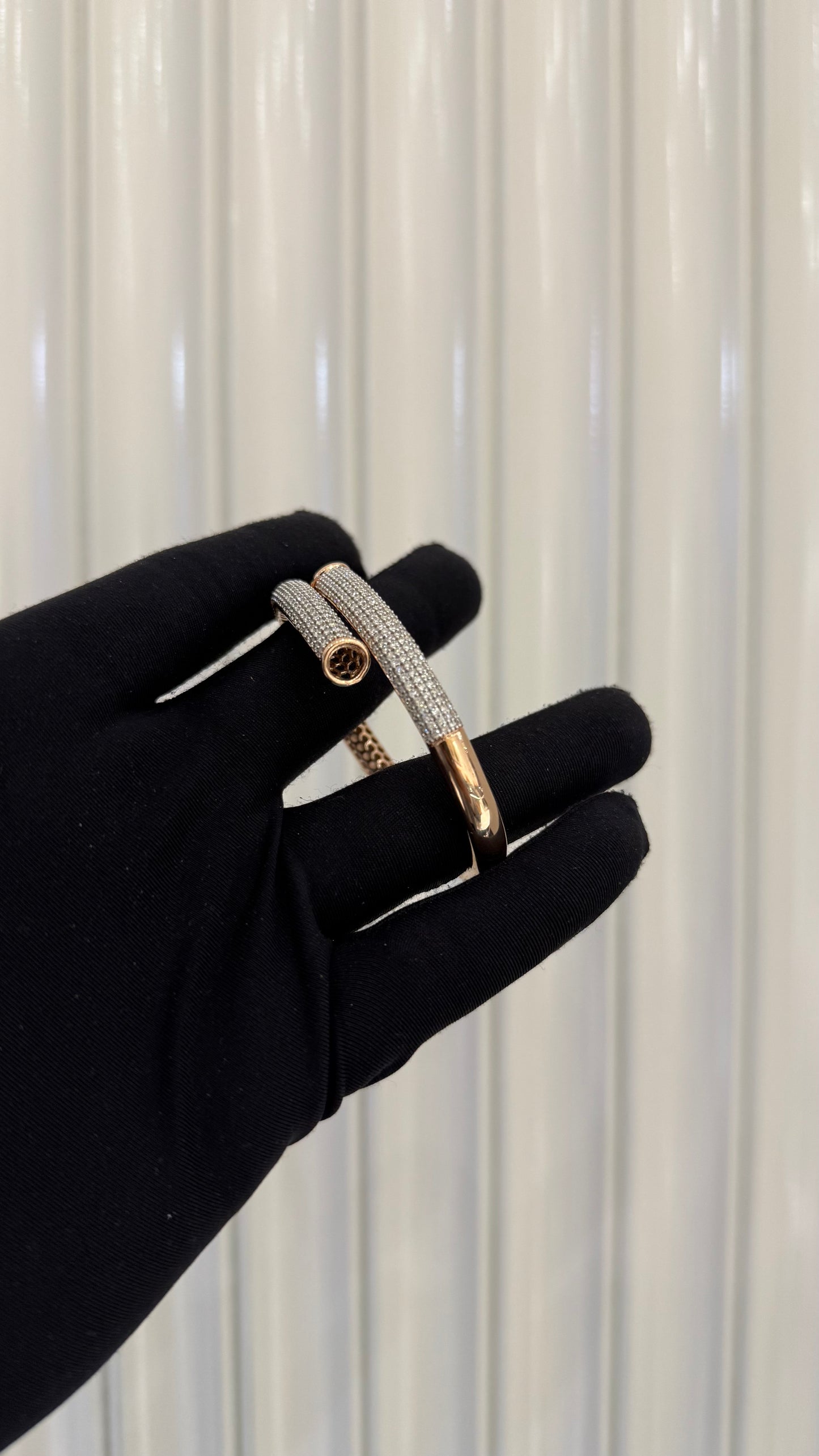 Luxury gold diamond bracelet featuring multiple rows of sparkling diamonds in a stylish cuff shape.