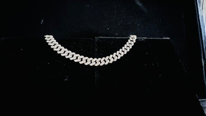 Stylish diamond Cuban chain bracelet with pavé-set diamonds, featuring bold interlocking links for a luxury statement look.