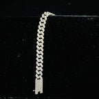 Stylish diamond Cuban chain bracelet with pavé-set diamonds, featuring bold interlocking links for a luxury statement look.