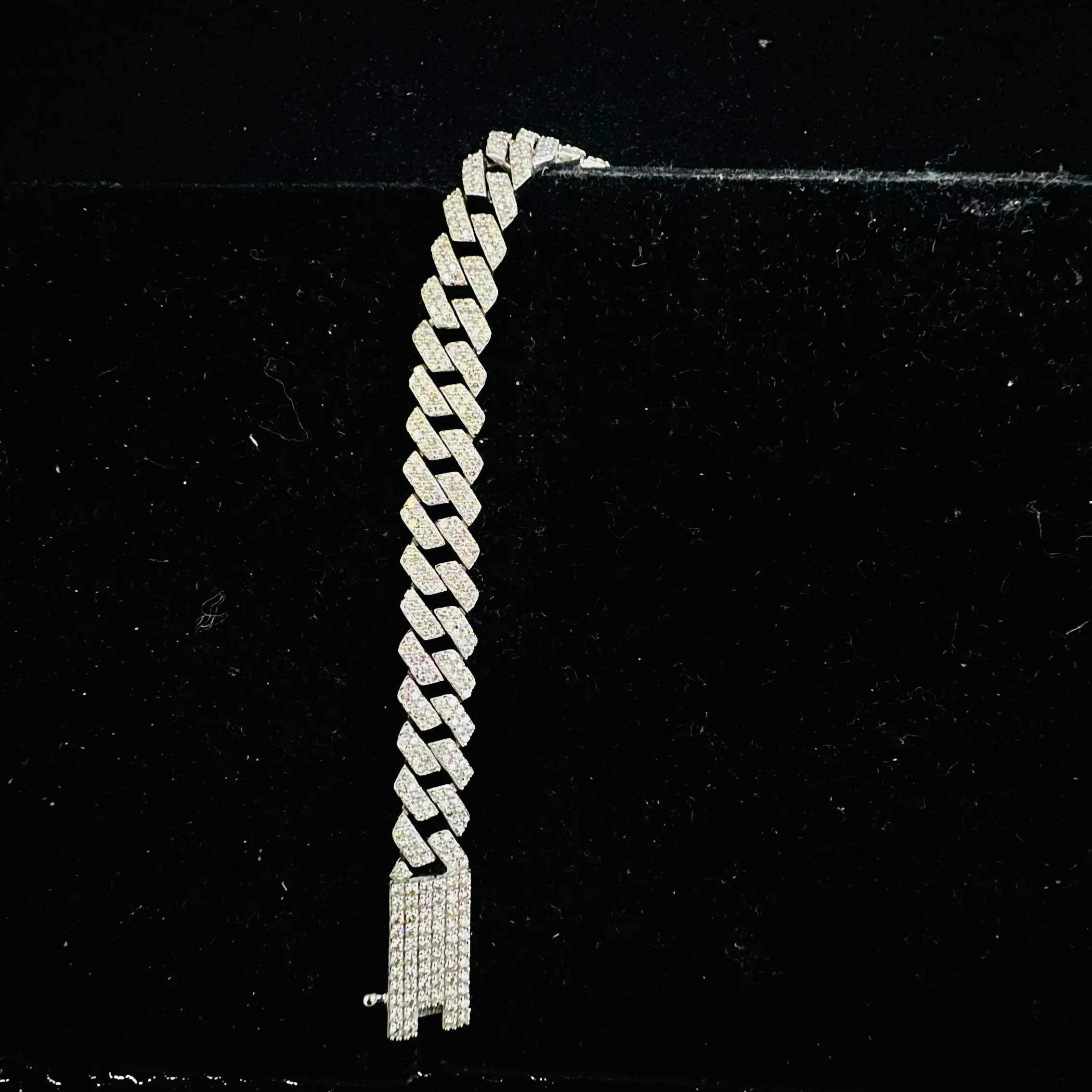 Stylish diamond Cuban chain bracelet with pavé-set diamonds, featuring bold interlocking links for a luxury statement look.