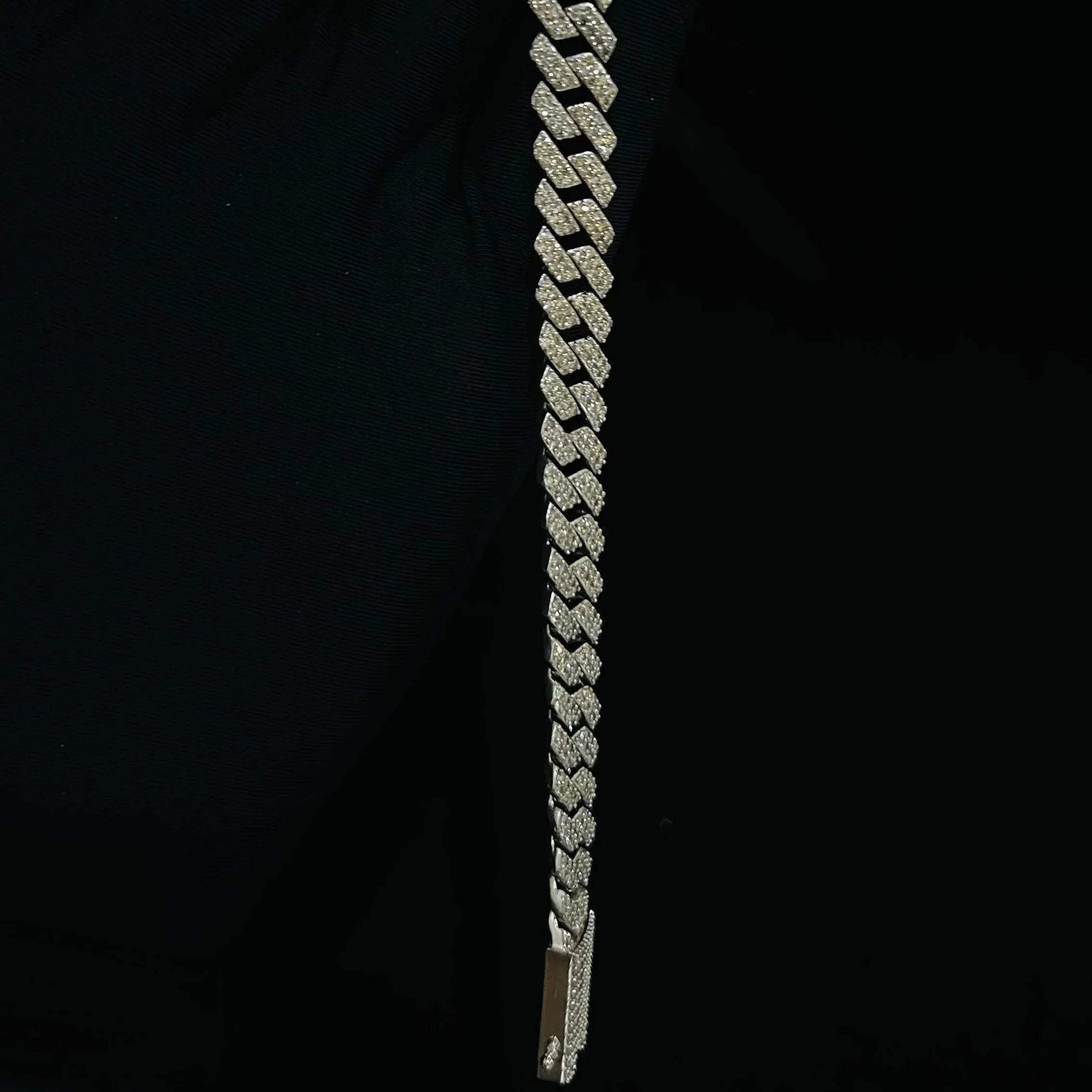 Stylish diamond Cuban chain bracelet with pavé-set diamonds, featuring bold interlocking links for a luxury statement look.