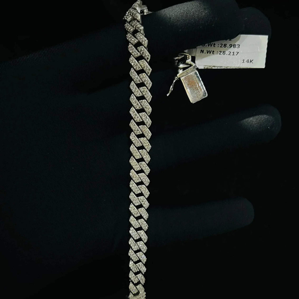 Stylish diamond Cuban chain bracelet with pavé-set diamonds, featuring bold interlocking links for a luxury statement look.