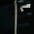 Stylish diamond Cuban chain bracelet with pavé-set diamonds, featuring bold interlocking links for a luxury statement look.