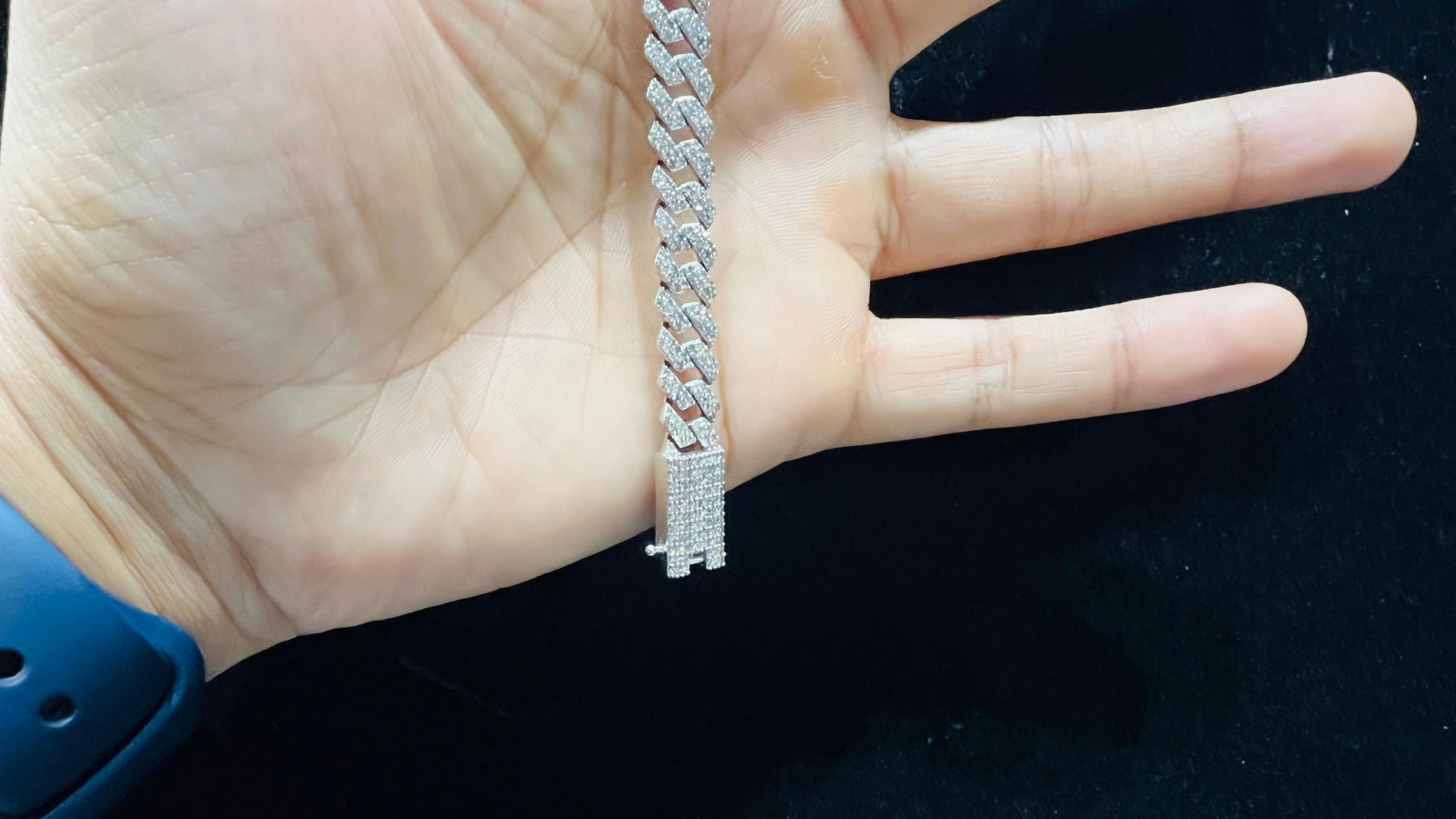 Stylish diamond Cuban chain bracelet with pavé-set diamonds, featuring bold interlocking links for a luxury statement look.