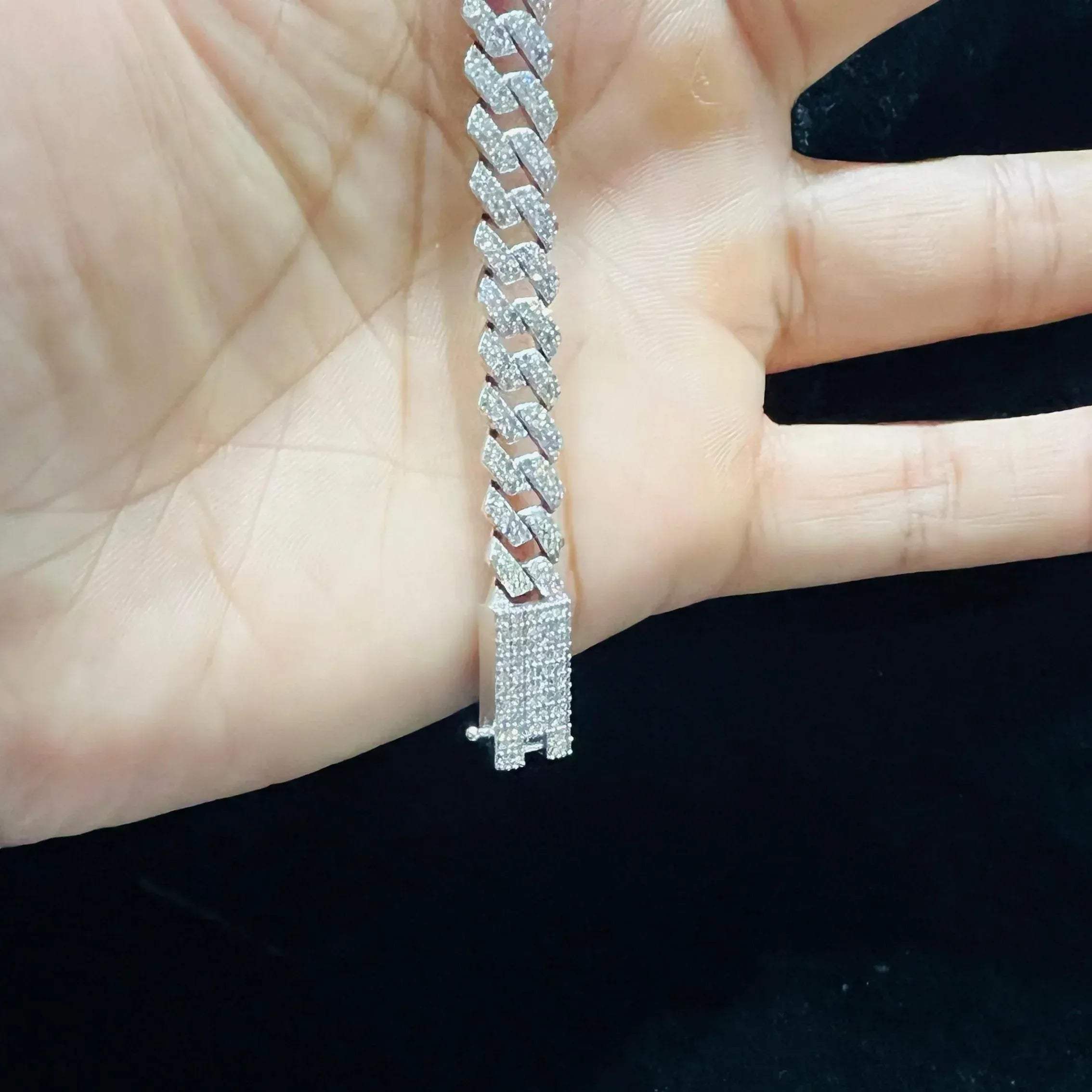 Stylish diamond Cuban chain bracelet with pavé-set diamonds, featuring bold interlocking links for a luxury statement look.