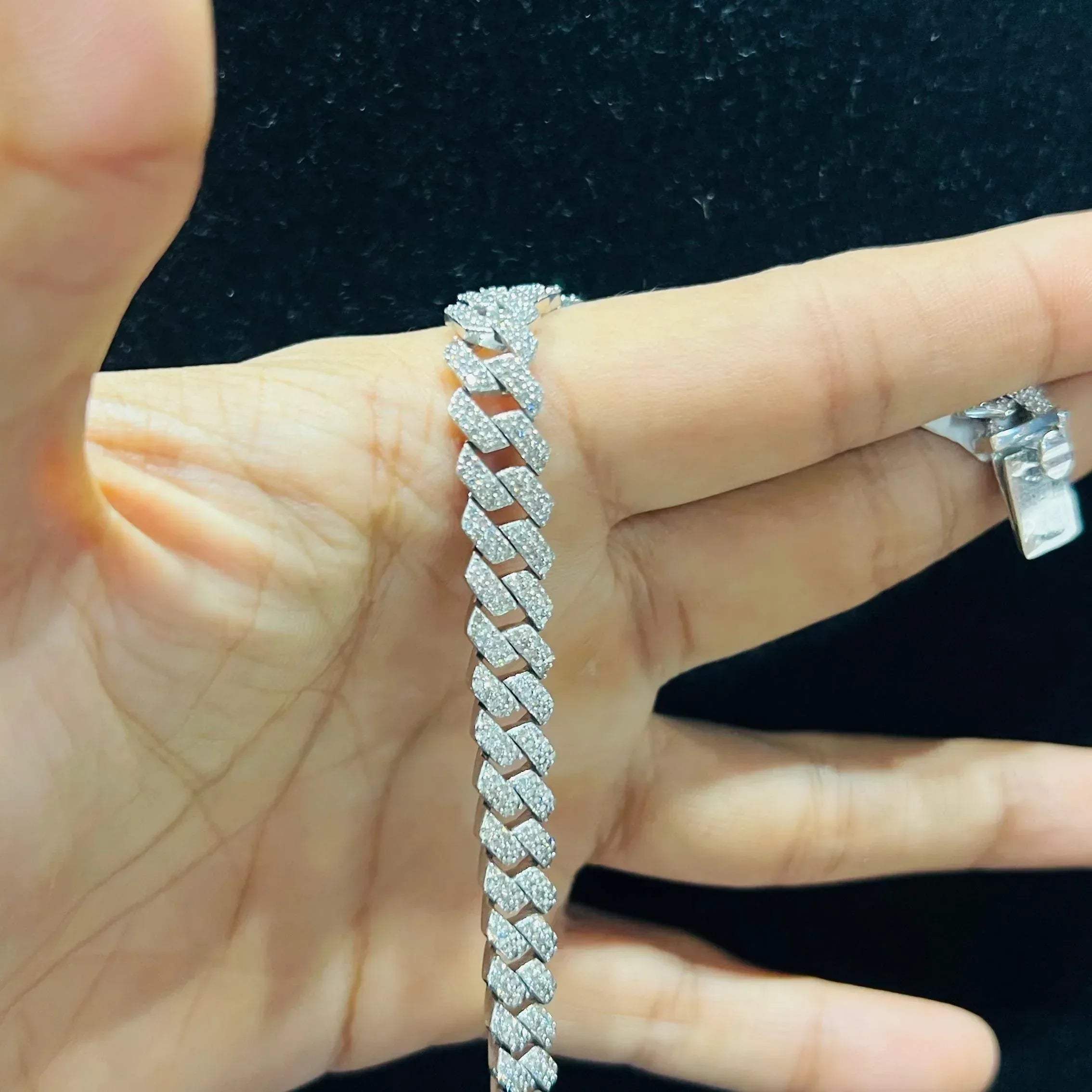 Stylish diamond Cuban chain bracelet with pavé-set diamonds, featuring bold interlocking links for a luxury statement look.