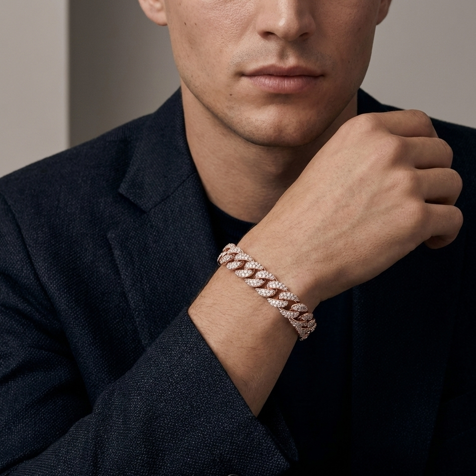 A man in black suit is showing a real diamond cuban link bracelet worn in his hand.