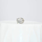 Round solitaire diamond stud earring on a white background