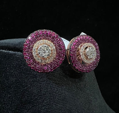 A pair of gold diamond stud earrings with a rose gold band on a black mannequin.