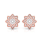 gold flower-shaped earrings with diamond accents on a white background