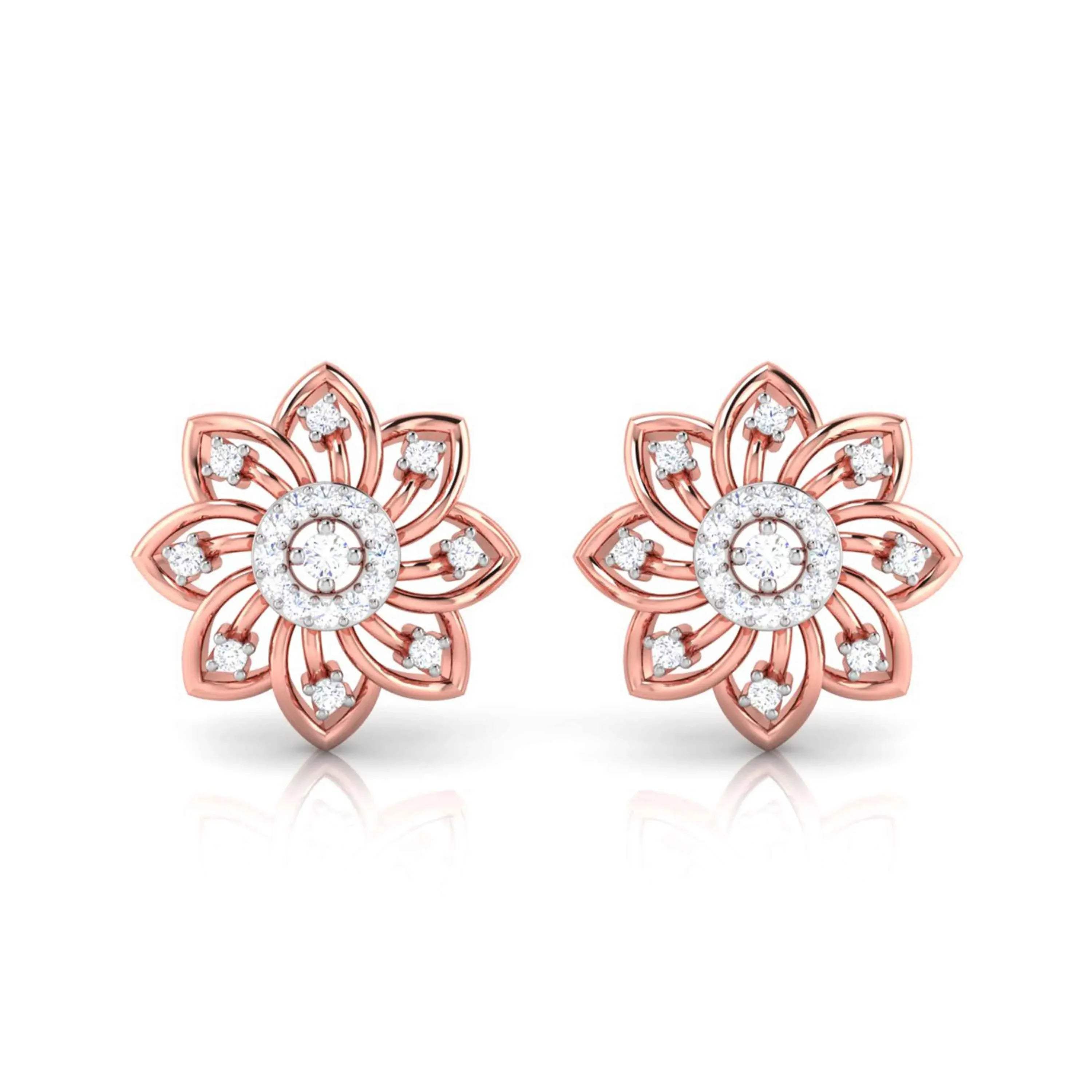 gold flower-shaped earrings with diamond accents on a white background