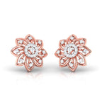 gold flower-shaped earrings with diamond accents on a white background