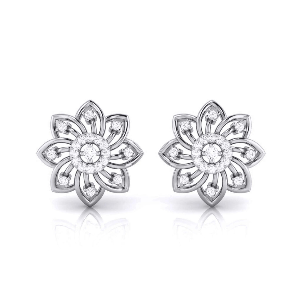 Pair of white gold flower-shaped earrings with clear gemstones on a white background