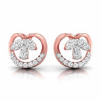 gold heart-shaped earrings with diamond accents on a white background