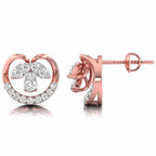 Rose gold earrings with heart and leaf design on a white background