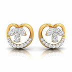 Pair of gold and diamond earrings on a white background