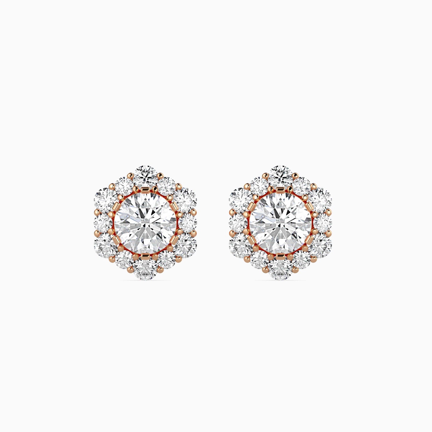 Pair of diamond earrings with rose gold accents on a white background
