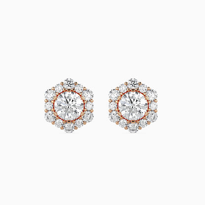 Pair of diamond earrings with rose gold accents on a white background