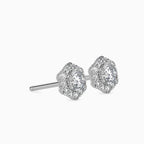Pair of diamond stud earrings on a white background