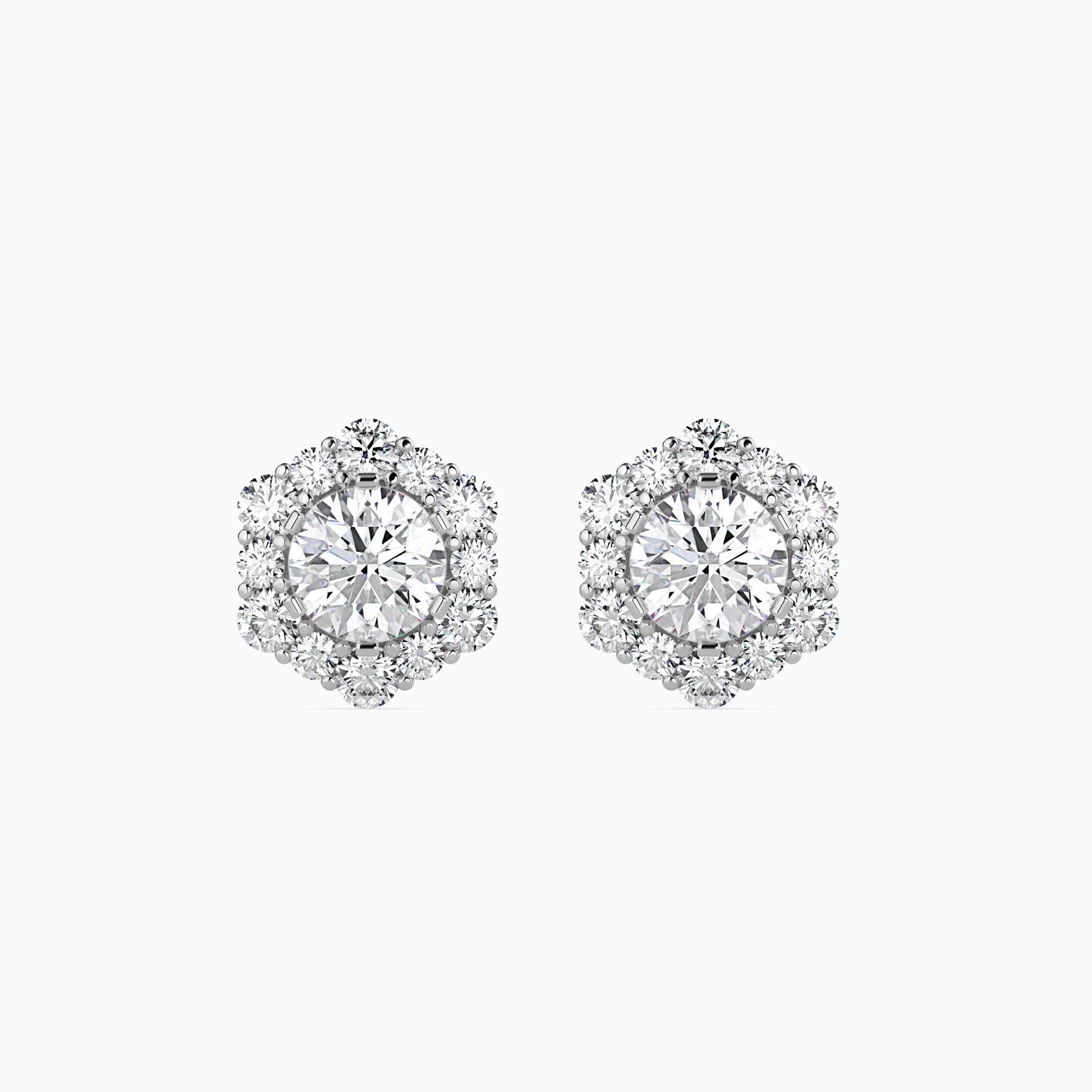 Pair of diamond earrings on a white background