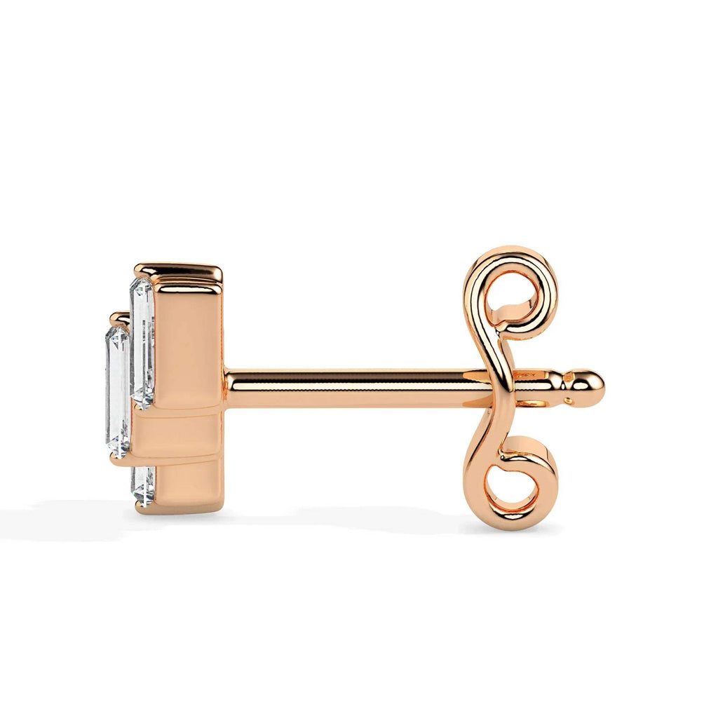gold earring with a diamond on a white background