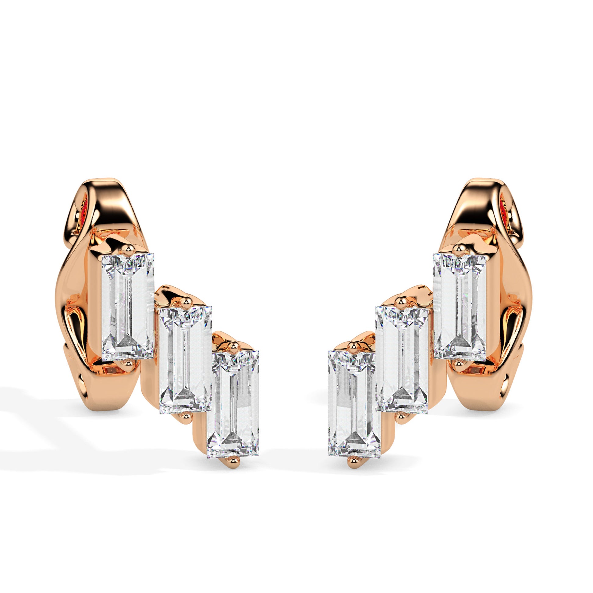 gold earrings with clear gemstones on a white background