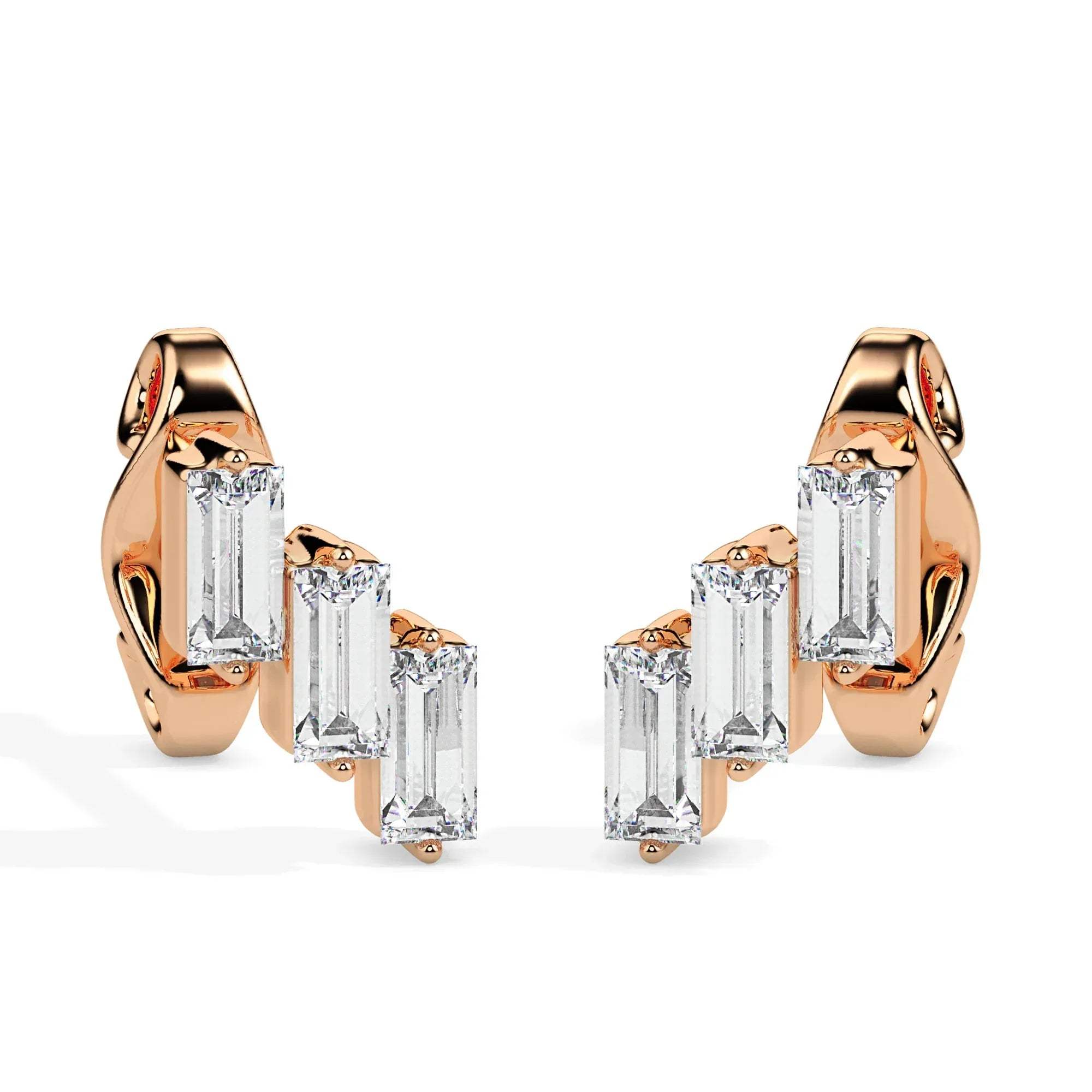 gold earrings with clear gemstones on a white background