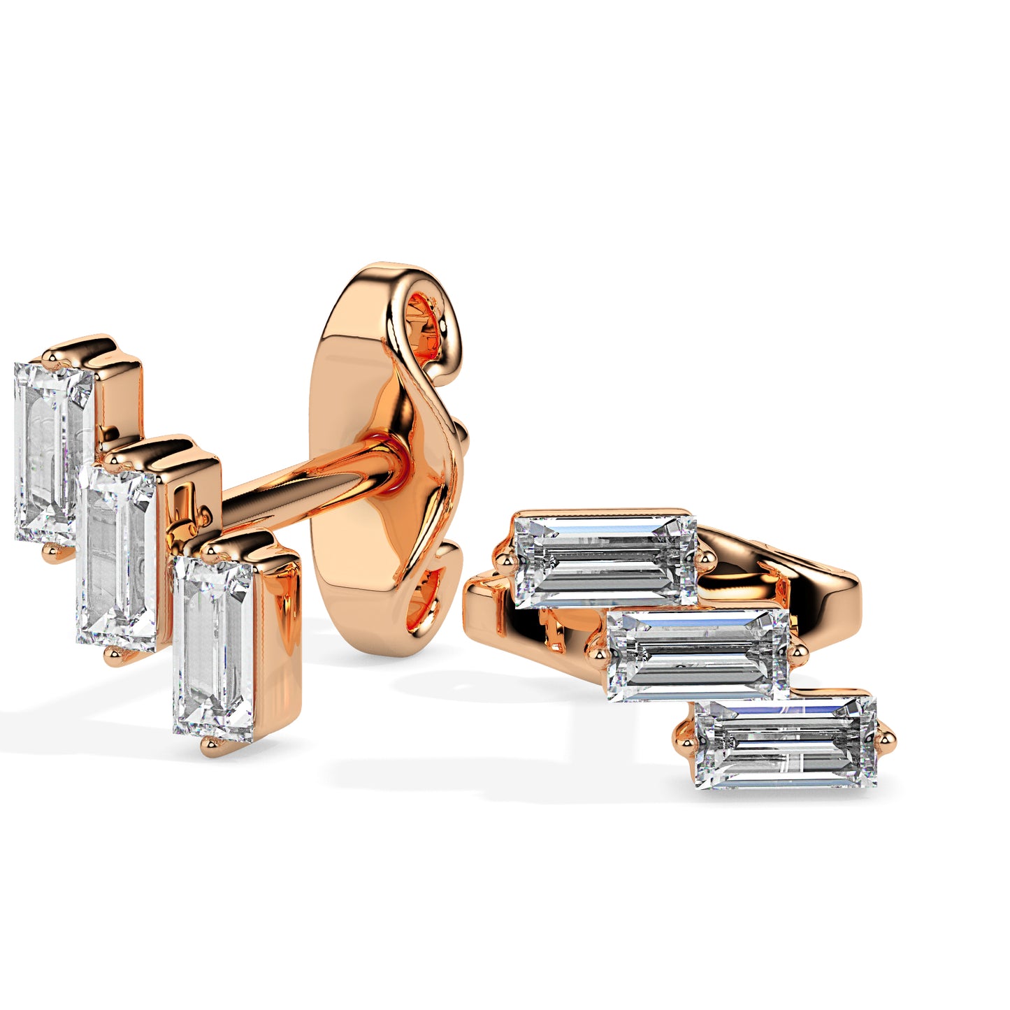 gold earrings with baguette cut gemstones on a white background