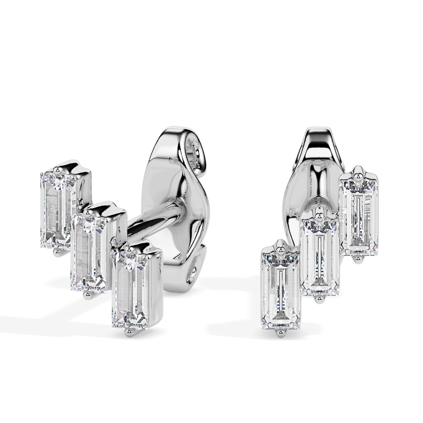 Pair of gold diamond earrings on a white background