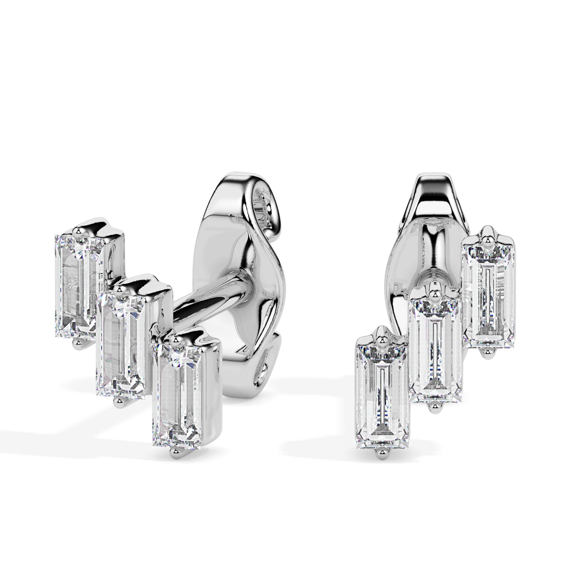 Pair of gold diamond earrings on a white background