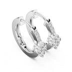 Pair of white gold hoop earrings with real diamond accents on a white background