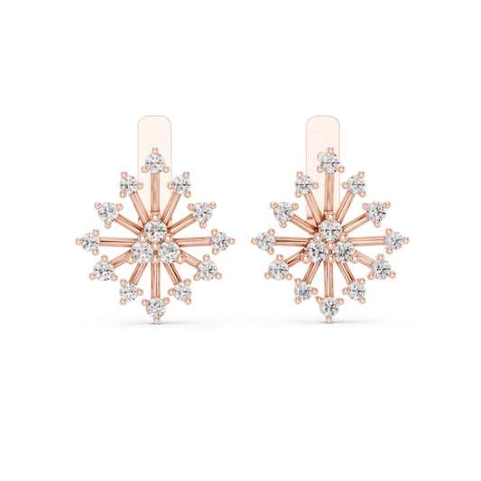 Rose gold and diamond snowflake earrings on a white background